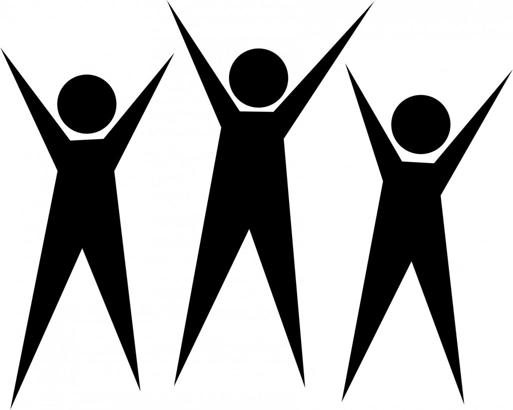 three figures of people all with their arms raised high in victory