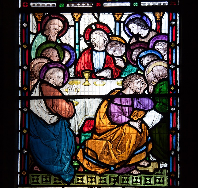 stained glass representation of a communion service