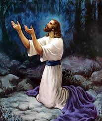 Jesus praying on his knees, hands lifted up, looking heavenward