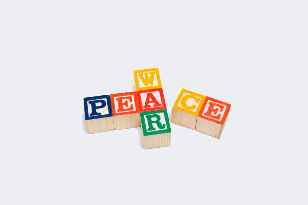 The words "War" and "Peace" are spelled out in block letters in a crossword fashion on a white background.  On this image, "Peace" is falling apart, possibly signifying that peace talks have fallen apart.  There is plenty of copy space available.