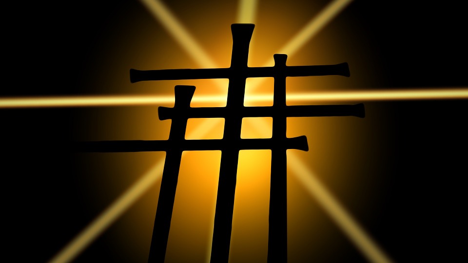 3 crosses with a burst of light behind