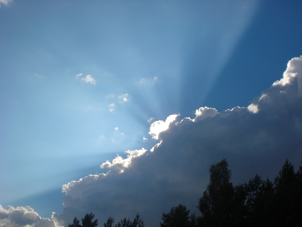 picture of God's glory like a bright light coming from behind clouds in rays