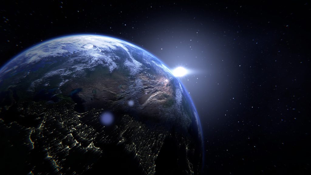 view of the earth from space with a bright light shining close beside it