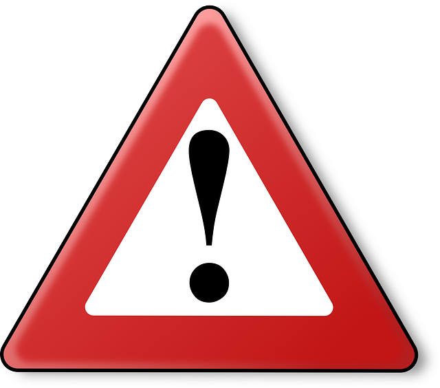 warning sign (black exclamation point inside a red triangle