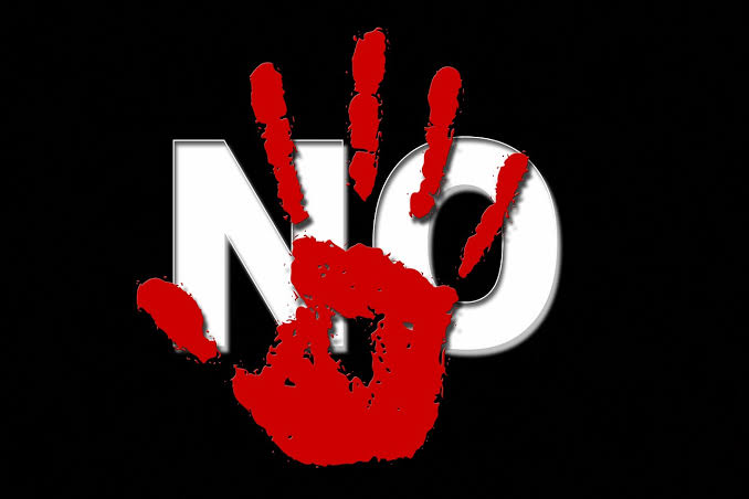 red handprint covering word NO in while block letters against black background