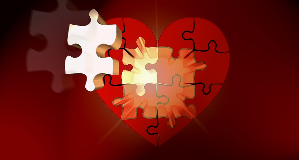 A heart puzzle with a missing piece moving into place