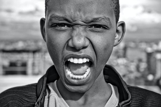 up close picture of young person screaming in anger