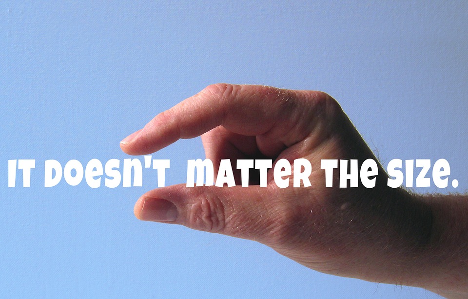 hand in pinching position, with words "It Doesn't Matter the Size" in between the fingers