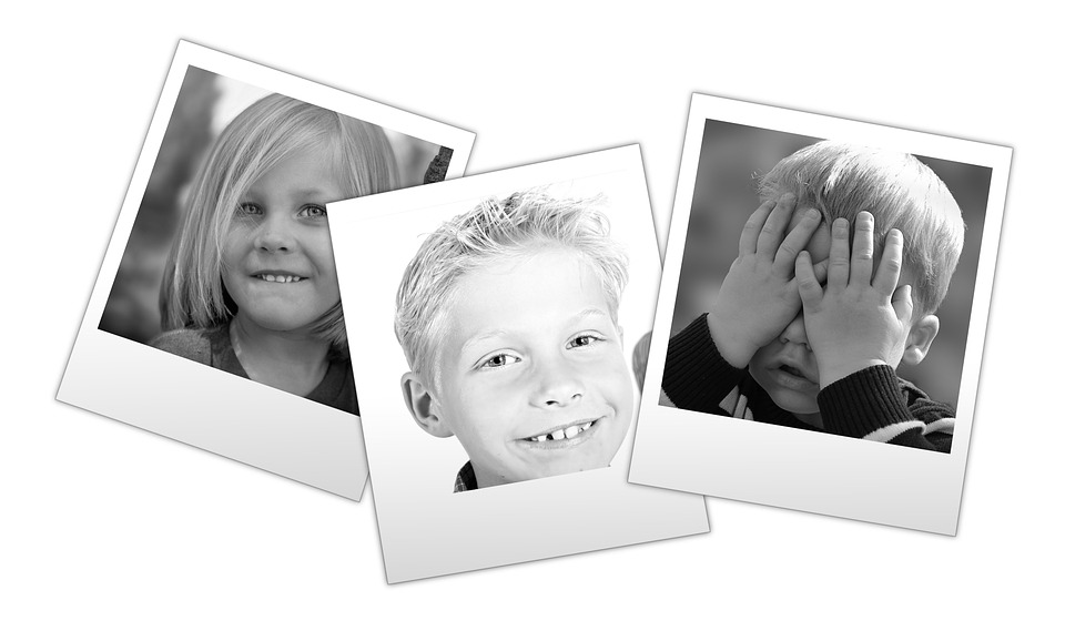 Snapshots of children smiling - the old Poloroid black and white type