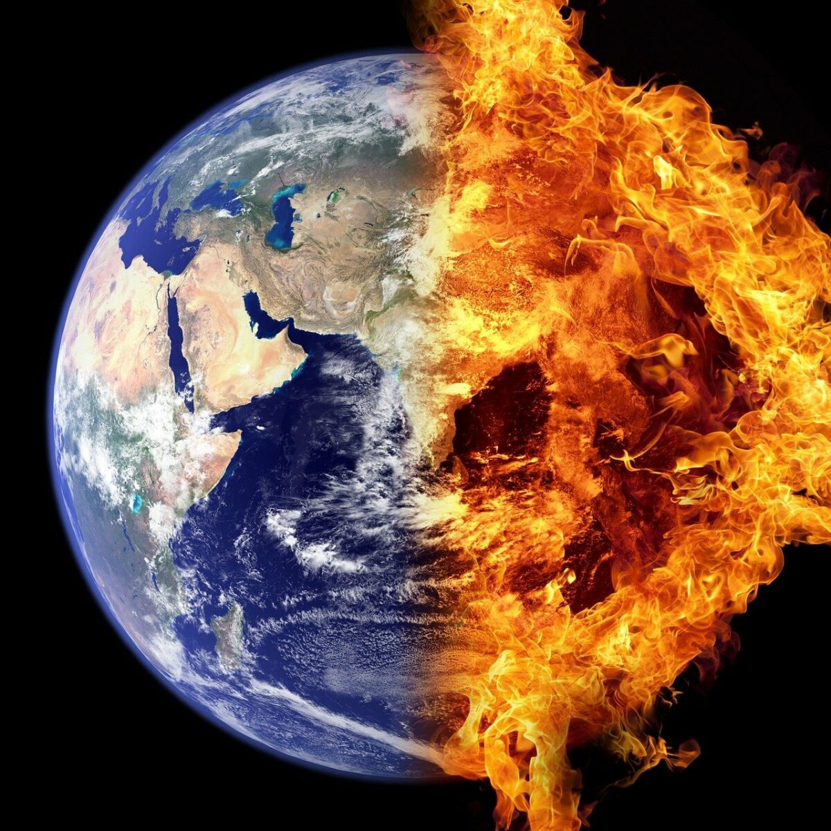 view of earth from space with half of it on fire