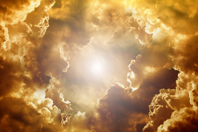 the clouds opening with a golden hue as if heaven