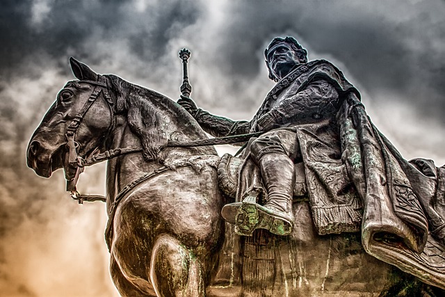 warhorse and rider with grey stormy sky background